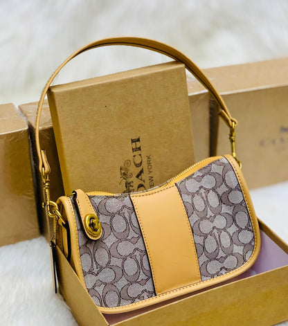 COACH Swinger In Signature Jacquard